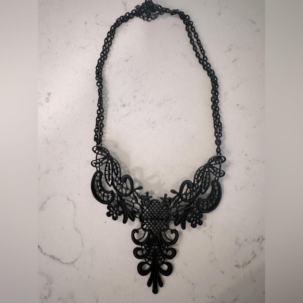 Black matte choker necklace.